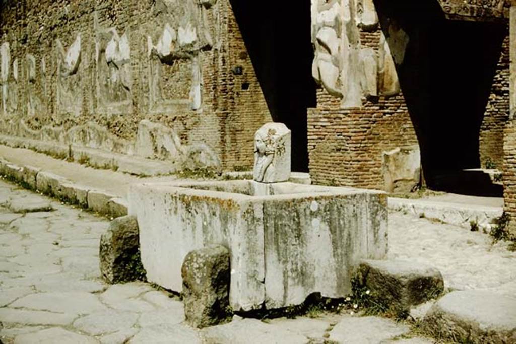 Via dellAbbondanza, Pompeii. 1957. Looking west along north side, towards fountain outside VII.9.67/68.  Photo by Stanley A. Jashemski.
Source: The Wilhelmina and Stanley A. Jashemski archive in the University of Maryland Library, Special Collections (See collection page) and made available under the Creative Commons Attribution-Non Commercial License v.4. See Licence and use details.
J57f0156
