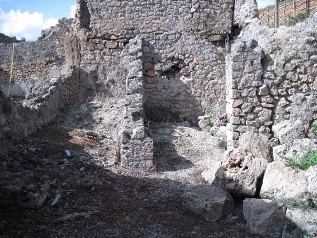 I.2.23 Pompeii. September 2010. Looking north from entrance doorway towards corridor, on left, and small room, on right. Photo courtesy of Drew Baker.
