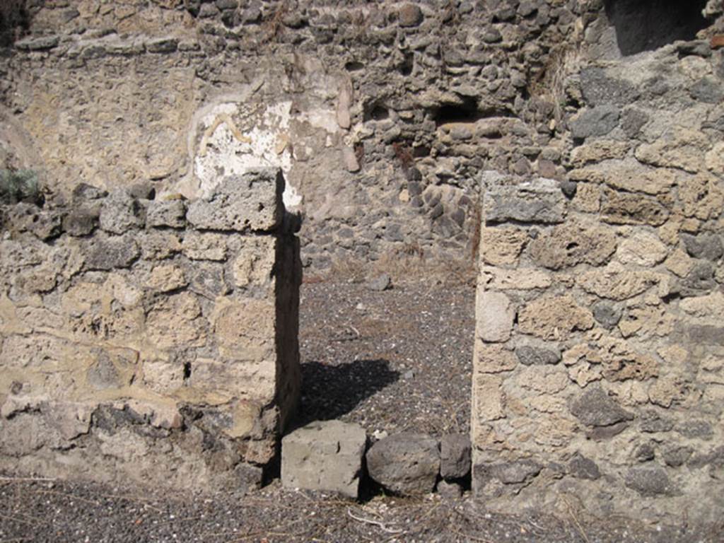 I.3.5 Pompeii. September 2010. North wall of rear vaulted room with doorway into a rear room. This room now appears to be part of I.3.6, as the north and west wall have disappeared.  Photo courtesy of Drew Baker.
