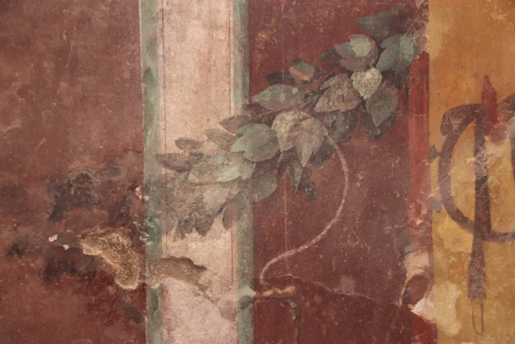 I.6.2 Pompeii. September 2019. West wall of east wing of cryptoporticus, detail of garland and wall decoration.
Photo courtesy of Klaus Heese.
