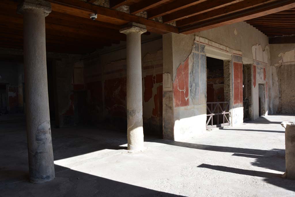 I.7.1 Pompeii. October 2019. 
Looking east along north portico of peristyle, towards doorways to oecus, another oecus, a small room and the triclinium. On the walls are a landscape painting and plants on the base of the wall.
Foto Annette Haug, ERC Grant 681269 DÉCOR.

