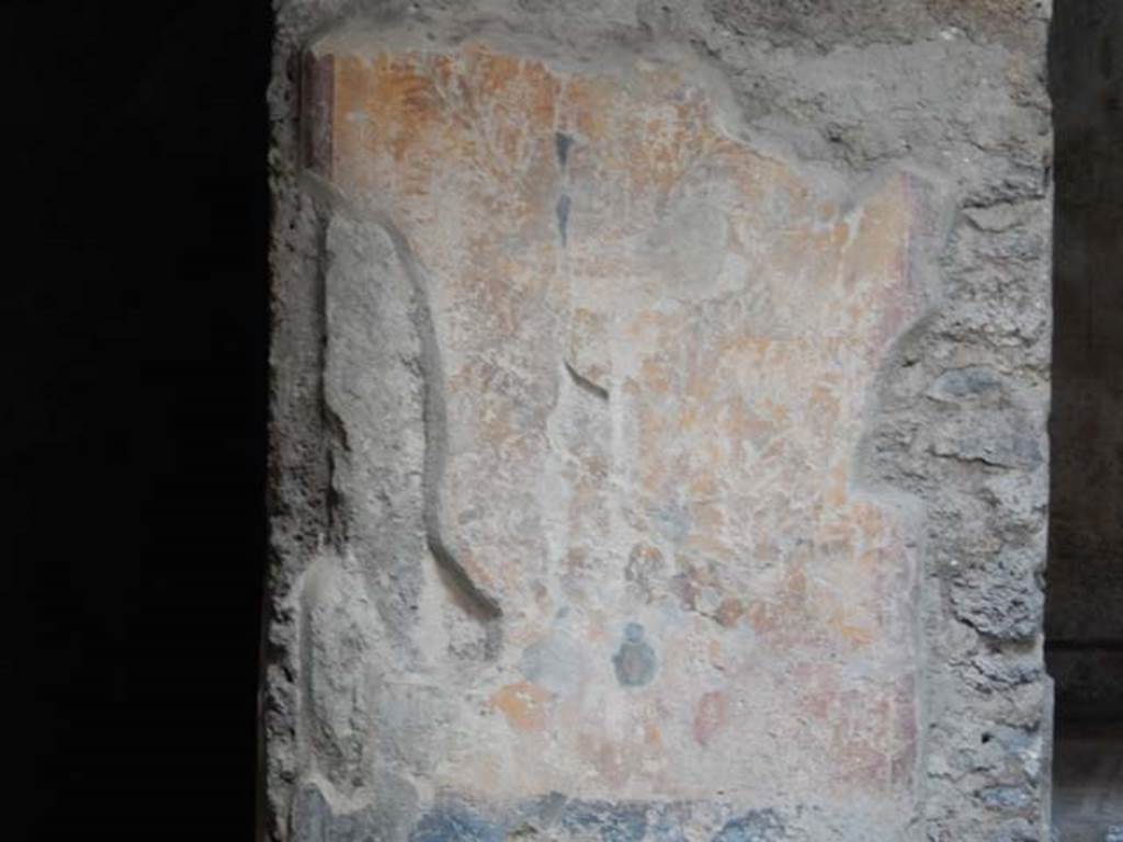 I.7.3 Pompeii. May 2017. Remains of painted panel on east side of doorway to room on south side of garden area. Photo courtesy of Buzz Ferebee.
