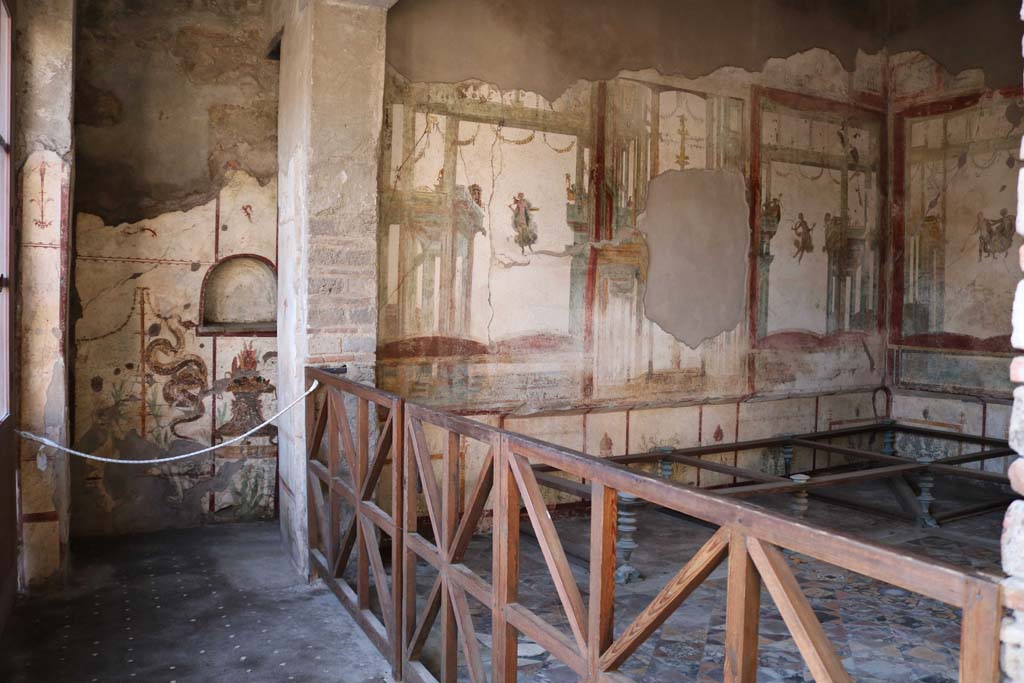 I.7.11 Pompeii. December 2018.
Looking towards west wall, with lararium, on left, and west wall of triclinium, on right. Photo courtesy of Aude Durand
