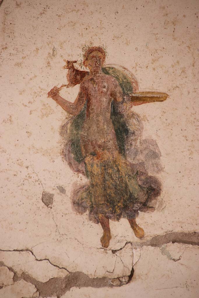 I.7.11 Pompeii. September 2021. 
Detail of painted figure from panel at south end of west wall. Photo courtesy of Klaus Heese.
