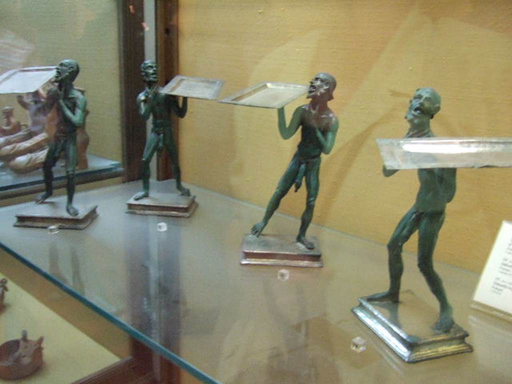 Four bronze statues (Placentarius) found in I.7.10-12 Pompeii.  Now in Naples Archaeological Museum