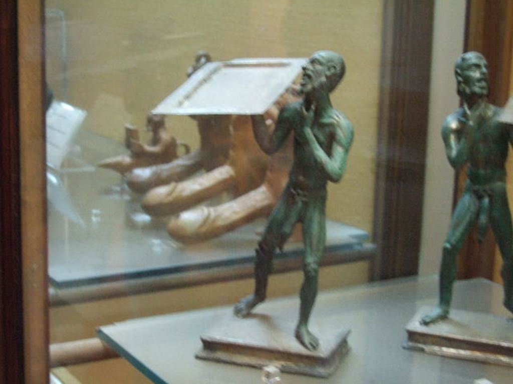 Bronze statues found in I.7.10-12.  Now in Naples Archaeological Museum. Inventory number 143760.