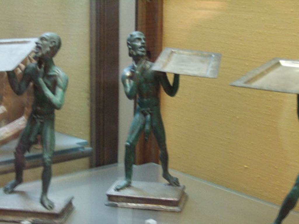 Bronze statues found in I.7.10-12.  Now in Naples Archaeological Museum