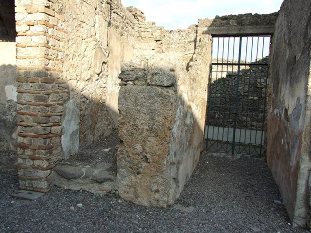 I.7.11 Pompeii. December 2006. Entrance corridor and doorway, looking east. The doorway on the left of the photo led to the stairs to the upper floor.
