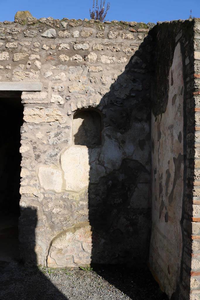I.7.11 Pompeii. December 2018. 
Remains of lararium on east side of atrium belonging to original house I.7.10.
Photo courtesy of Aude Durand.
