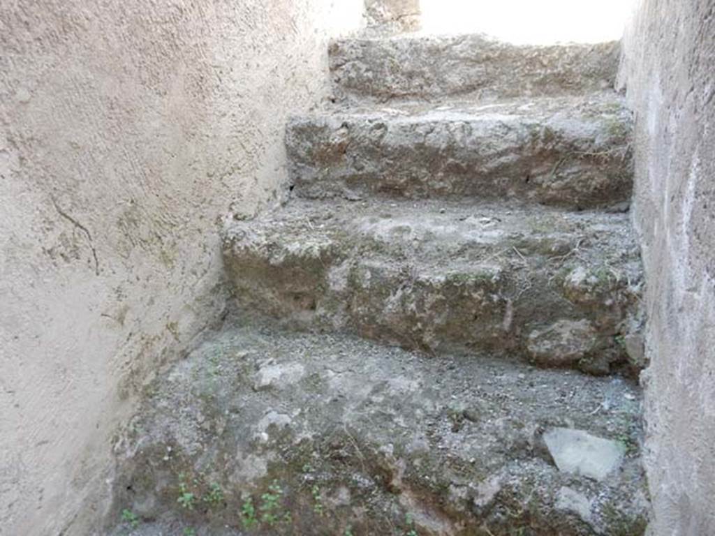 I.7.11 Pompeii. May 2017. Stairs to the upper floor, on the north wall in I.7.10. Photo courtesy of Buzz Ferebee.

