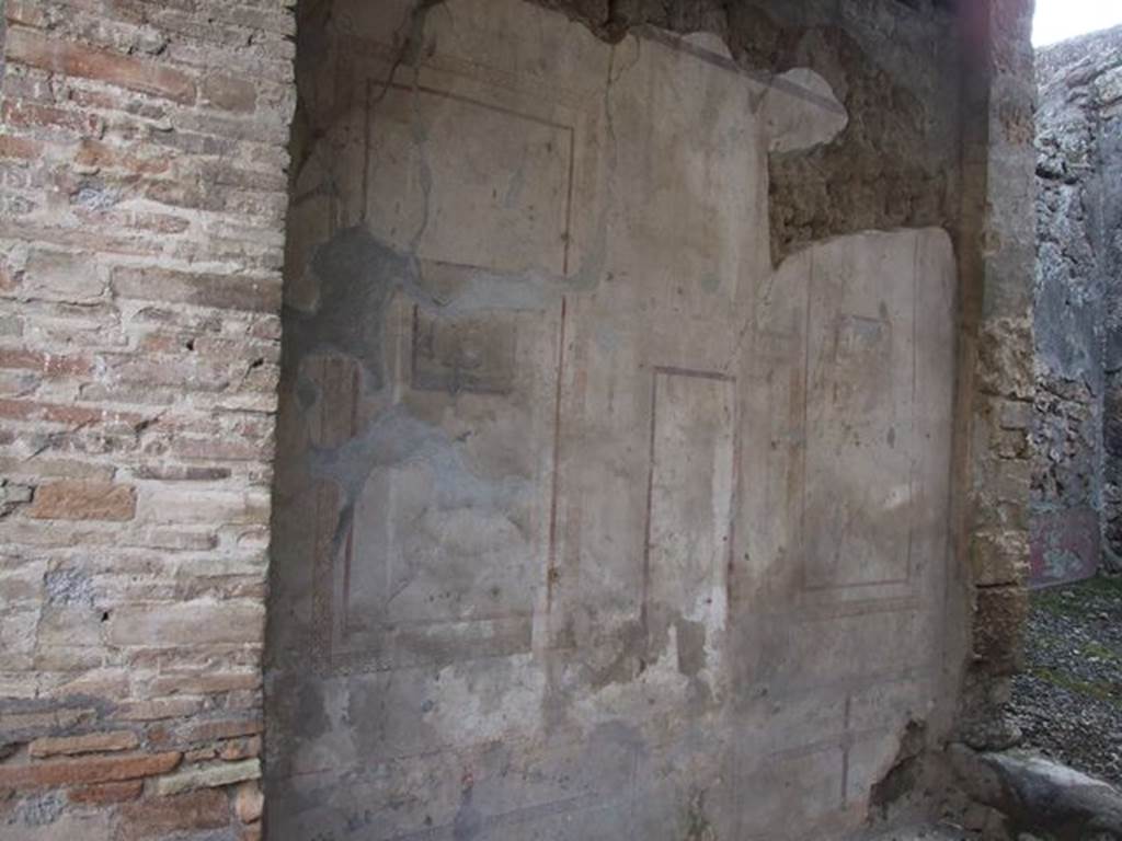 I.7.11 Pompeii. December 2006. South wall of tablinum, with doorway through to bath room ?.