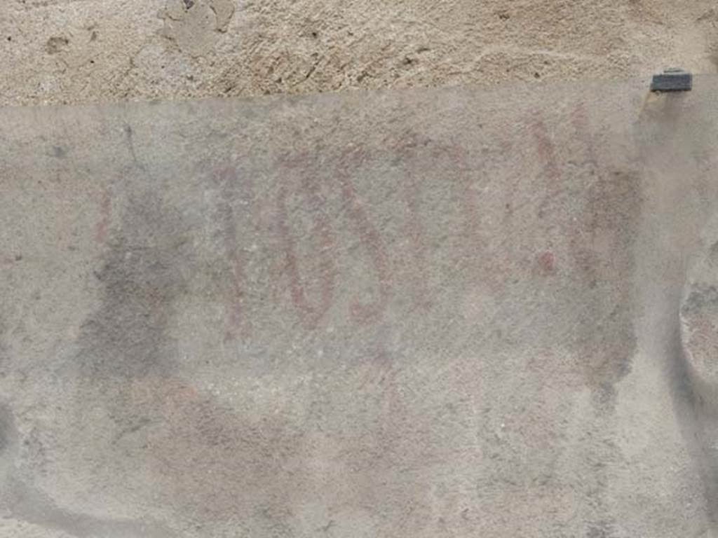 I.7.14 Pompeii. May 2017. Detail of part of the remains of the painted inscription  POSTVM   [CIL IV 7238].  Photo courtesy of Buzz Ferebee.
