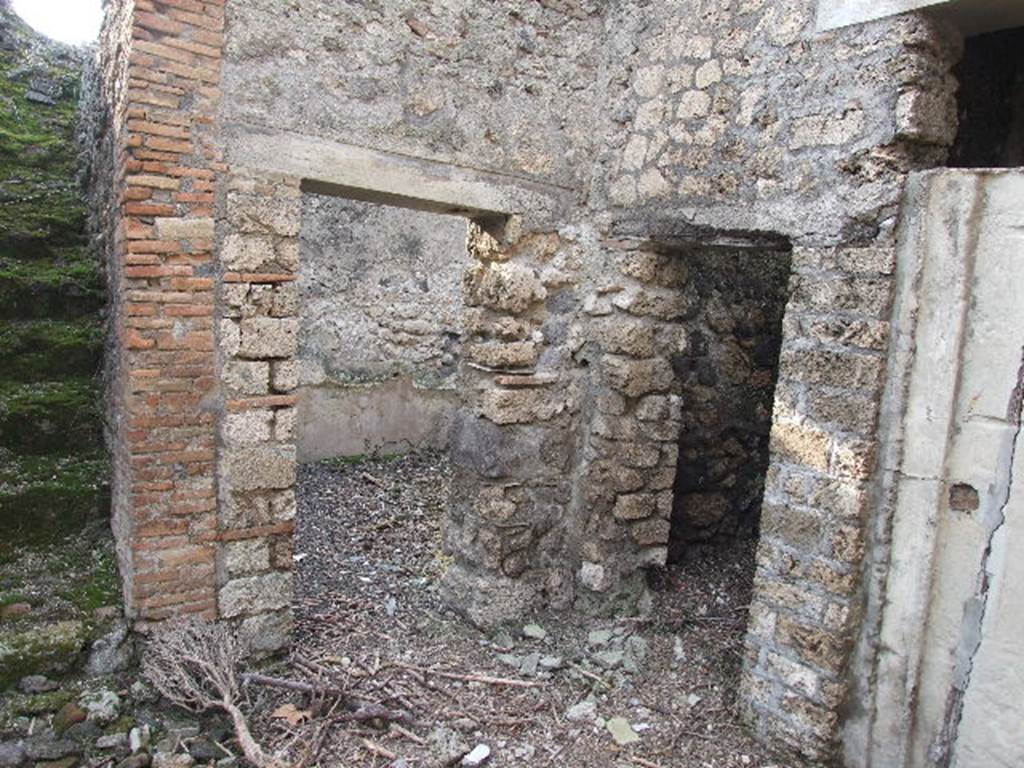 I.7.19 Pompeii. December 2006. Doorways to rooms in north-west corner of atrium.