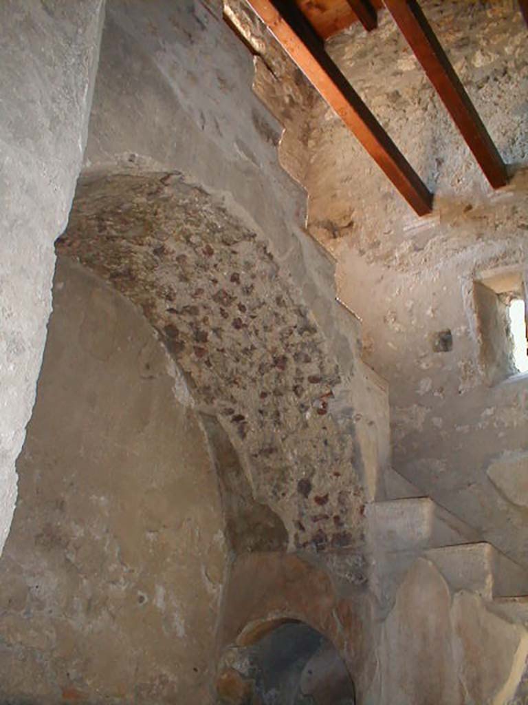 I.10.4 Pompeii. May 2004. Room 2, large arched recess under stone stairs.