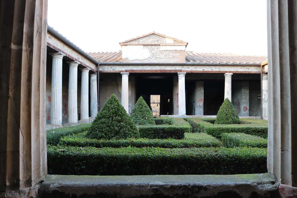 I.10.4 Pompeii. December 2018.  
Looking north across peristyle garden towards entrance doorway, in centre, from south-west portico. Photo courtesy of Aude Durand.

