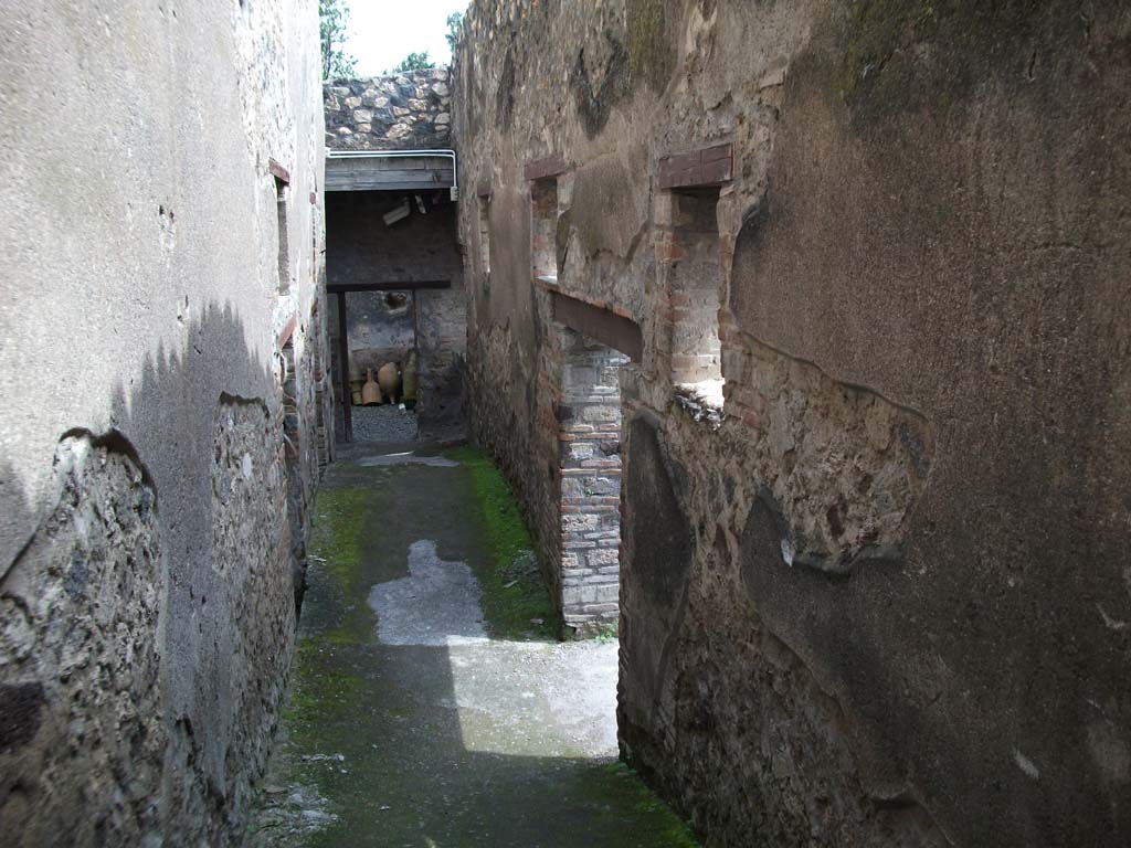 I.10.4 Pompeii. May 2010. Passageway P, leading to services area, see I.10.14, 15 and 16. Looking east.