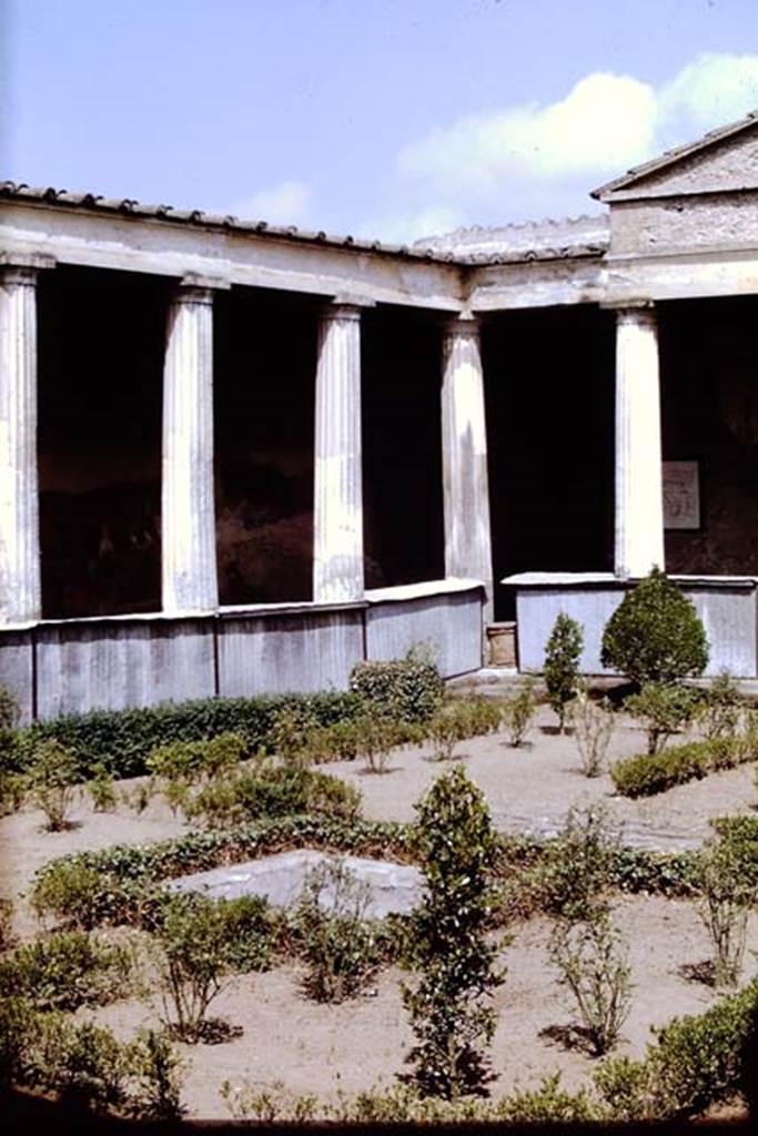 I.10.4 Pompeii. 1968.  North-west corner of peristyle garden with covered over pluteus to try and protect the paintings.  Photo by Stanley A. Jashemski.
Source: The Wilhelmina and Stanley A. Jashemski archive in the University of Maryland Library, Special Collections (See collection page) and made available under the Creative Commons Attribution-Non Commercial License v.4. See Licence and use details.
J68f0053
