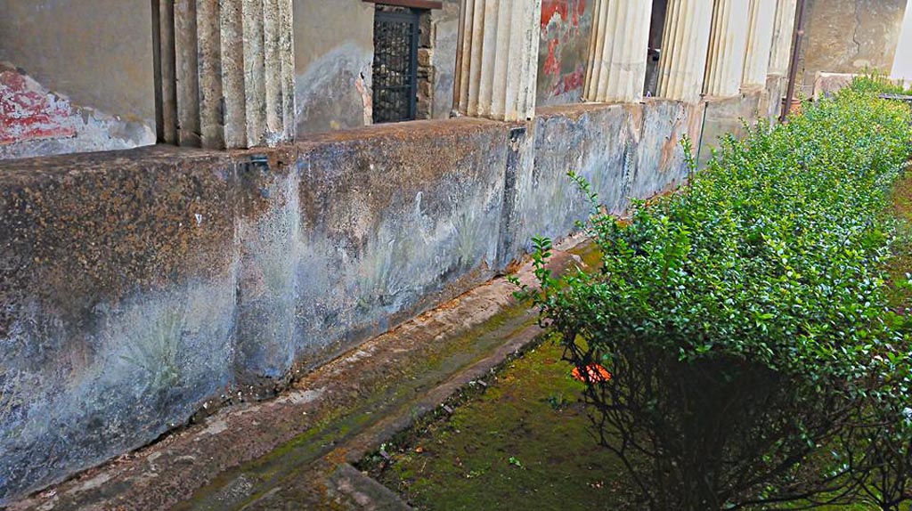 I.10.4 Pompeii. 2015/2016. 
Looking north along gutter in garden near west portico with remains of painted pluteus. Photo courtesy of Giuseppe Ciaramella.

