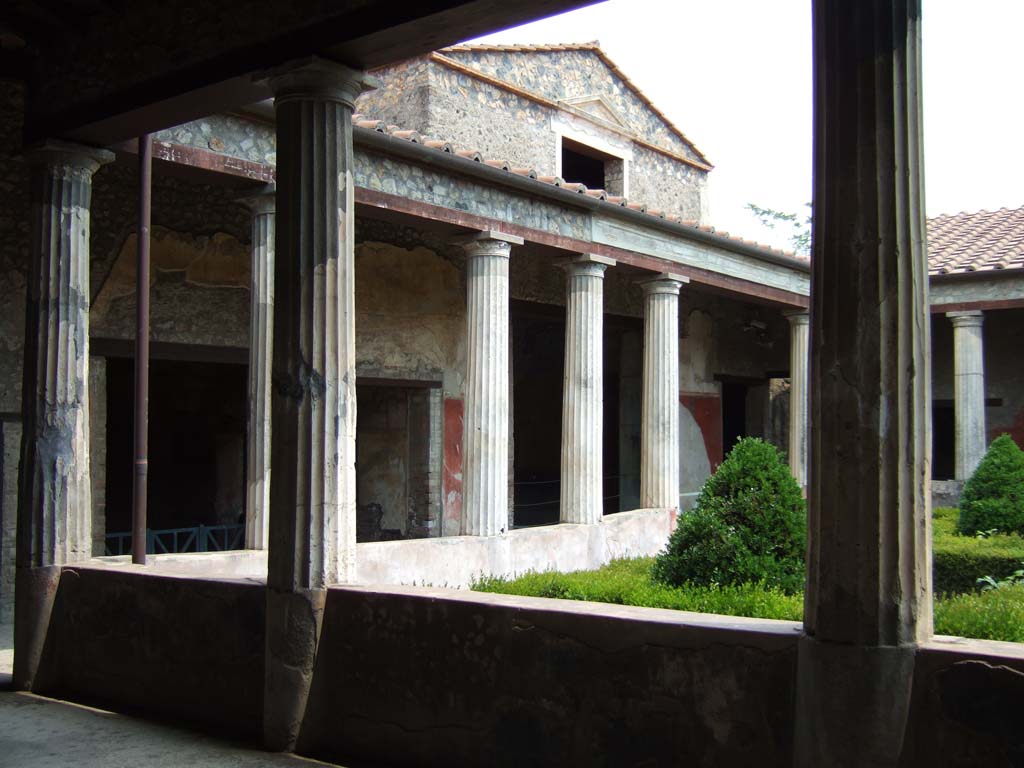 I.10.4 Pompeii. May 2006. East side of peristyle garden, looking towards east portico, from north portico.