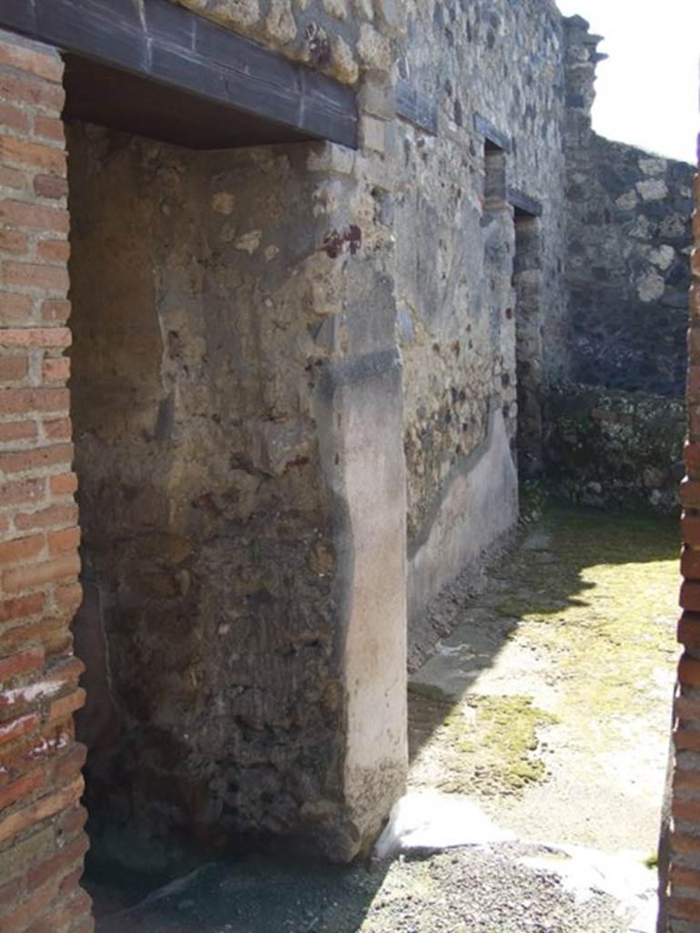 I.12.2 and I.12.1 Pompeii.  March 2009.  Doorway to room 13.