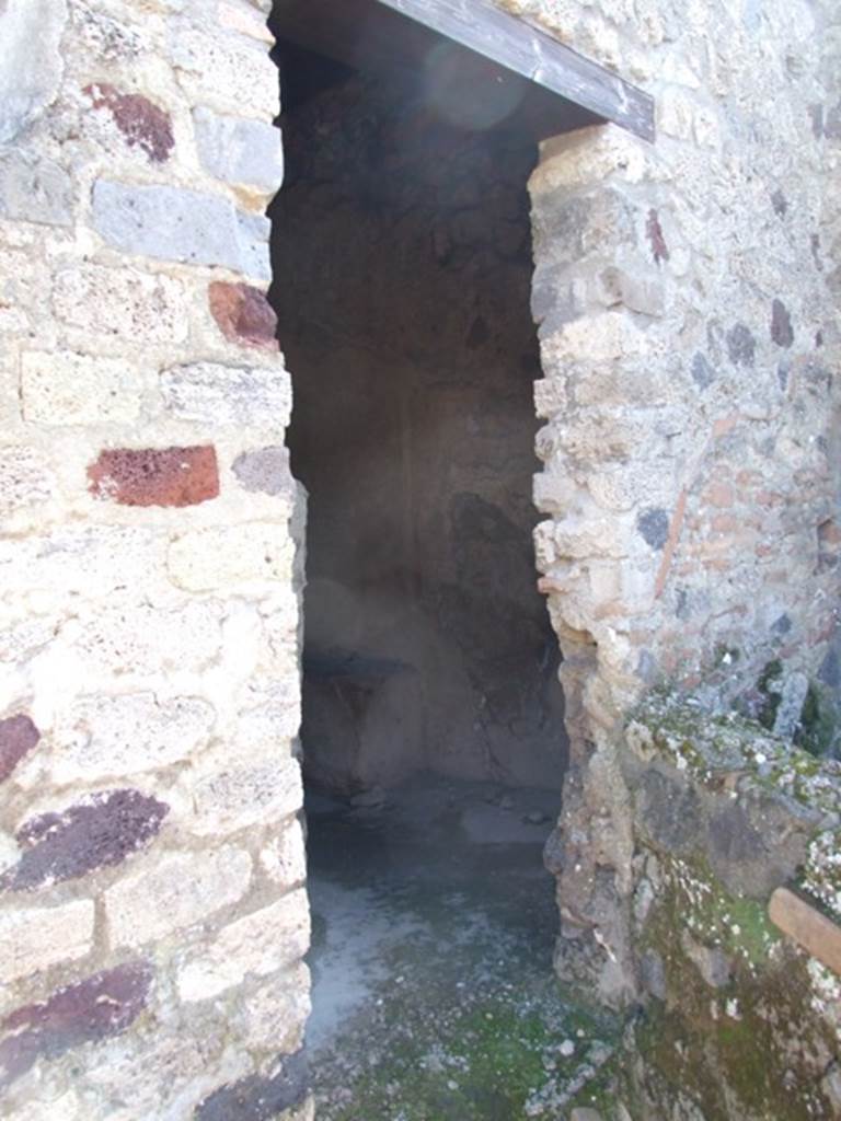 I.12.2 and I.12.1 Pompeii.  March 2009.   Room 15. Doorway to Latrine.