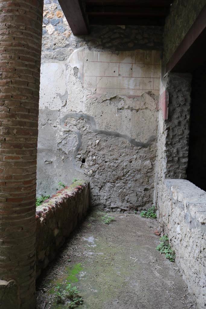 I.12.3 Pompeii. December 2018. 
Looking west along passageway on north side of garden, with window from triclinium.
Photo courtesy of Aude Durand.
