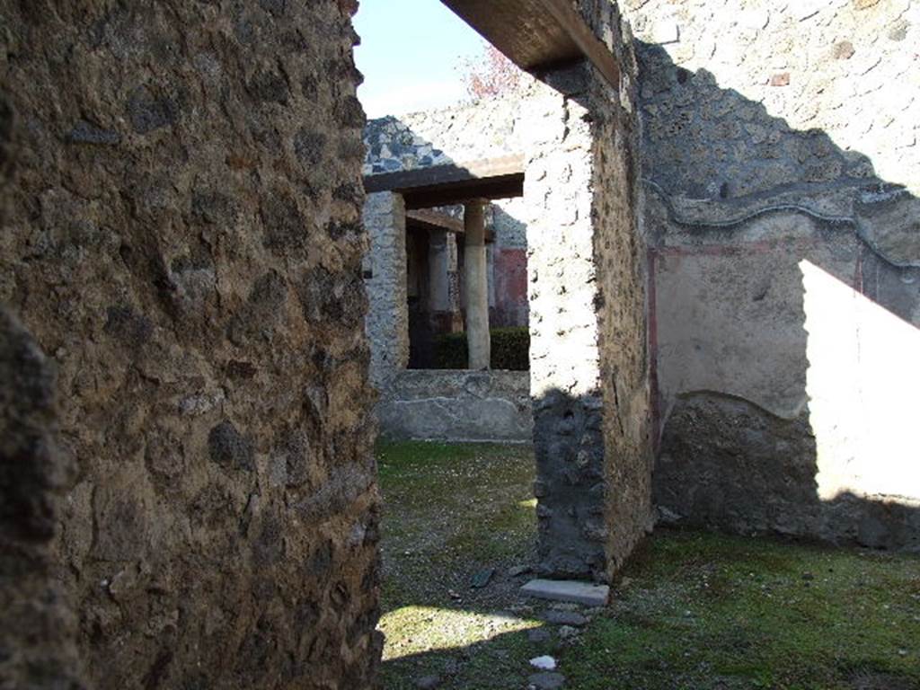 I.12.11 Pompeii. December 2006. Room to east of atrium, looking north towards west wall with doorway to atrium.  