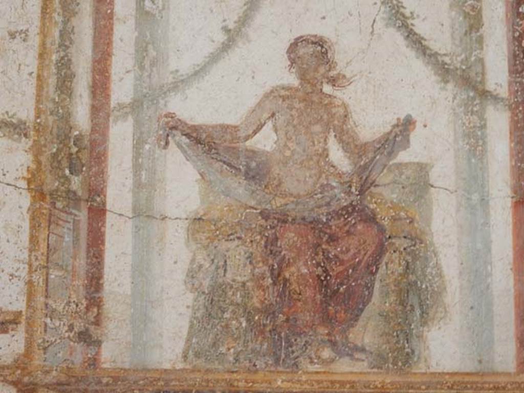 II.2.2 Pompeii. May 2016. Room “f”, detail of painted figure from centre of upper west wall.
Photo courtesy of Buzz Ferebee.
