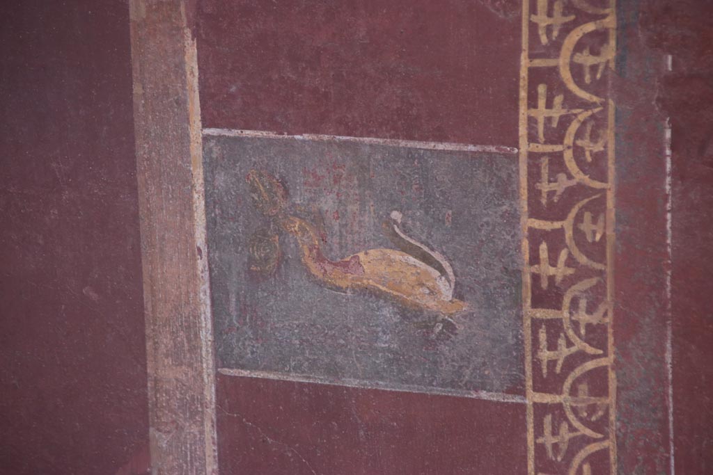 III.3.6 Pompeii. October 2022. Detail of painted dolphin decoration on east wall. Photo courtesy of Klaus Heese