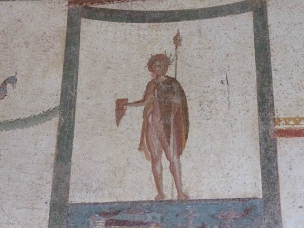 III.4.b Pompeii. March 2009. 
Room 4, upper north wall of anteroom/exedra. Painting of crowned figure with thyrsus and drinking horn.
According to Kuivalainen  
The pictorial programme as a whole and the posture of the youth support the identification as Bacchus, depicted half naked.
See Kuivalainen, I., 2021. The Portrayal of Pompeian Bacchus. Commentationes Humanarum Litterarum 140. Helsinki: Finnish Society of Sciences and Letters, (p.94-95, B1).

