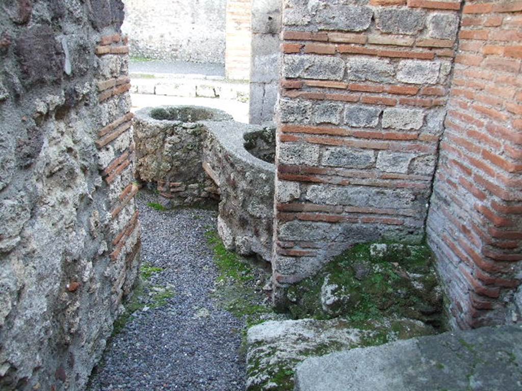 V.1.4 Pompeii.  December 2006. South west corner of rear room on west side, with base of stairs to upper floor. Looking south.