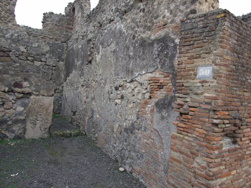 V.1.30 Pompeii.  December 2007.  South wall of shop and rear room.  