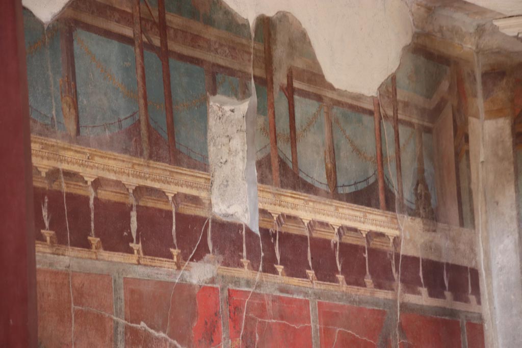 V.2.i Pompeii. October 2023. Oecus 21, detail from upper north wall. Photo courtesy of Klaus Heese.