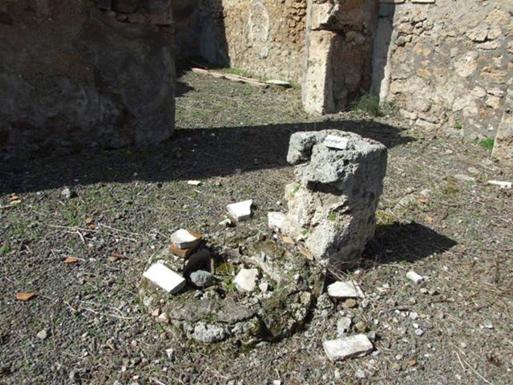 V.4.9 Pompeii. March 2009. Pillar on north-west corner of impluvium in atrium, with remains of cistern. Looking north-west.