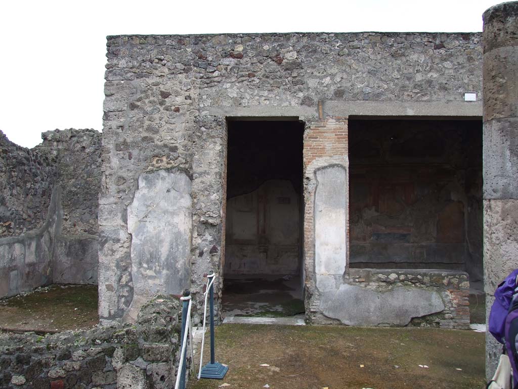 VI.7.18 Pompeii. December 2006. Looking south to doorways each leading into an oecus, with second oecus, on right. 
