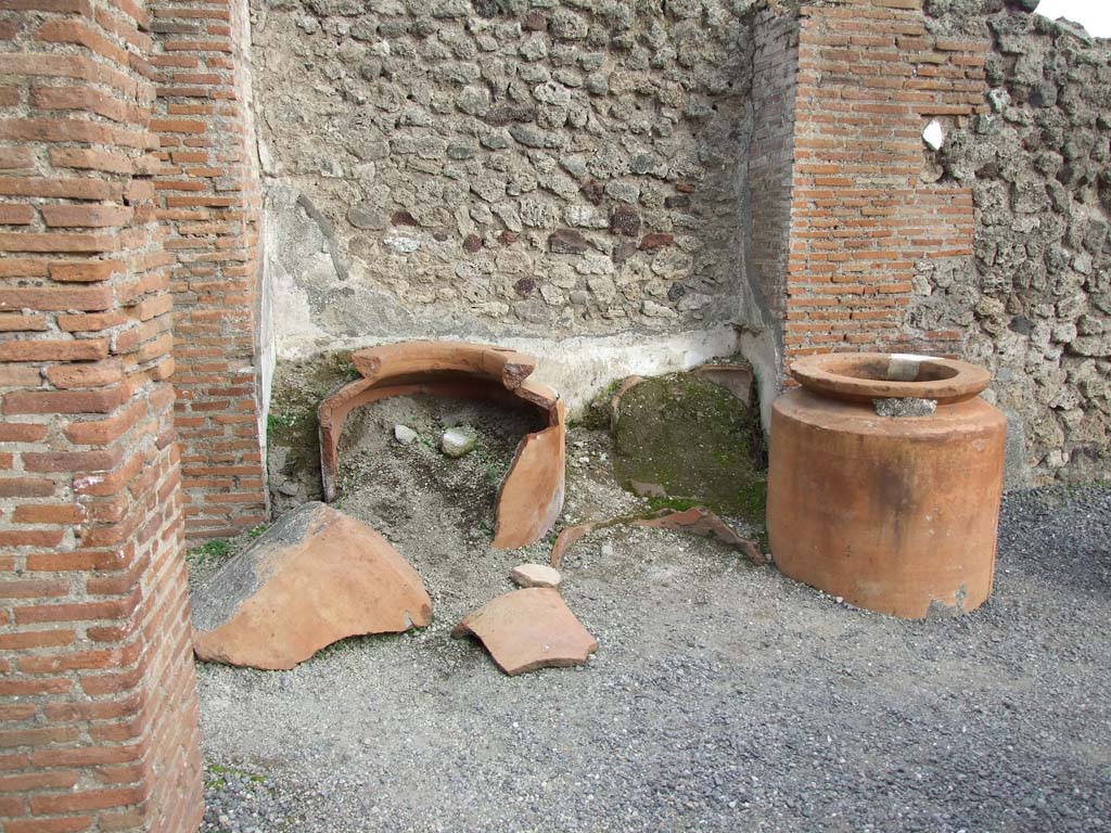 VI.8.9 Pompeii. December 2007. Remains of four dolia against the east wall in the north-east corner of the thermopolium.