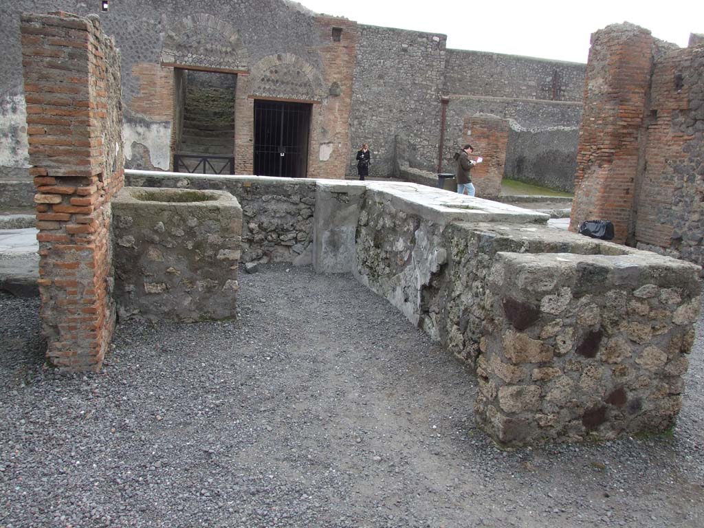 VI.8.9 Pompeii. December 2007. Rear of counter with hearth.