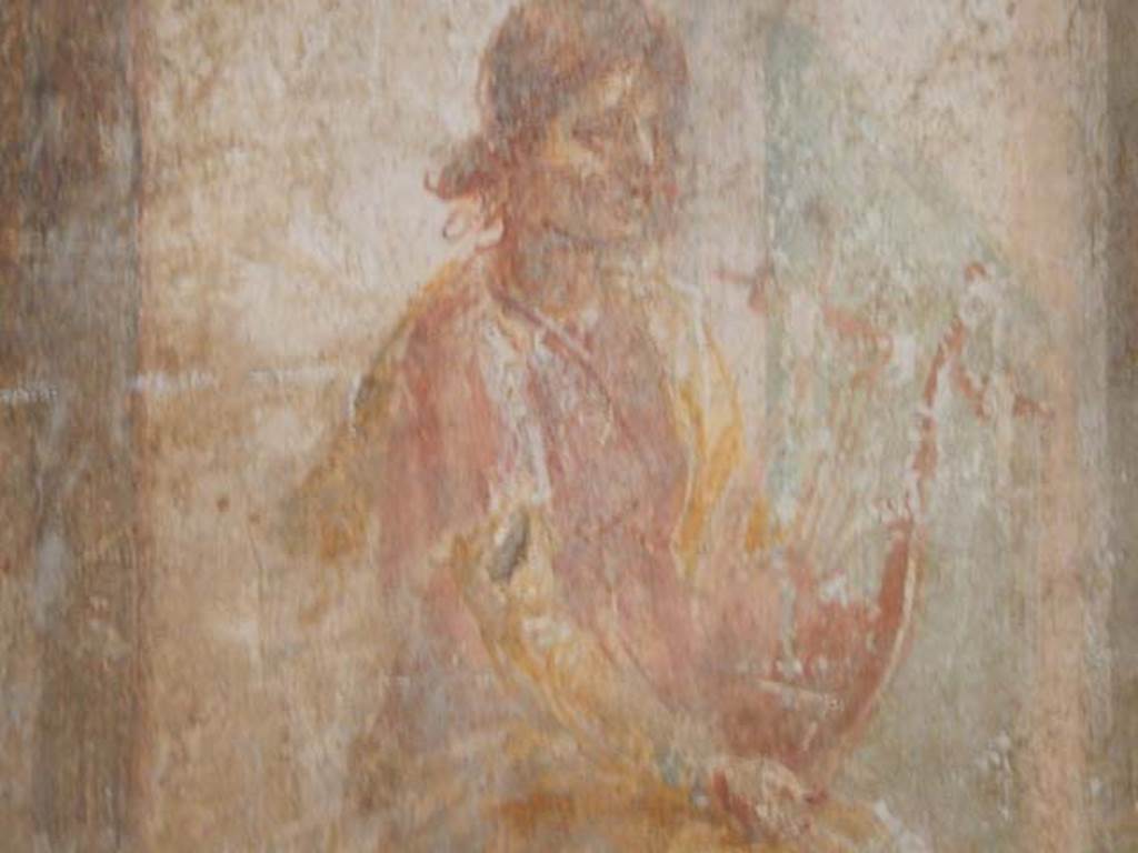 VI.8.23 Pompeii. May 2017. Detail of painted figure from west end of upper north wall.  Photo courtesy of Buzz Ferebee.
