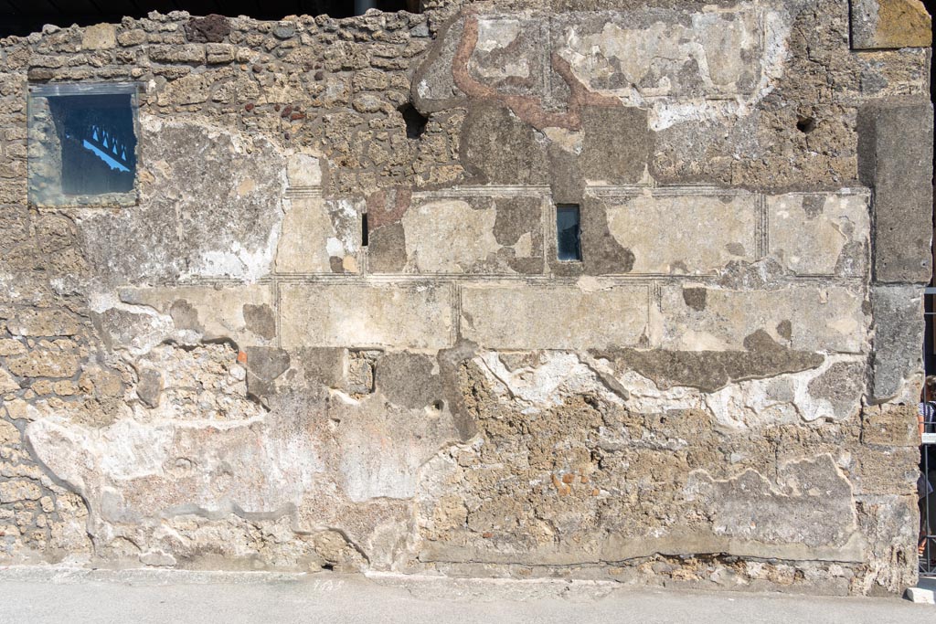 VI.9.6 Pompeii. October 2023. Exterior front facade on north side of entrance doorway, on right. Photo courtesy of Johannes Eber.