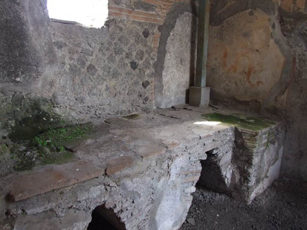 VI.9.7 Pompeii. March 2009. Room 4, hearth with painted lararium on the north wall of the kitchen.