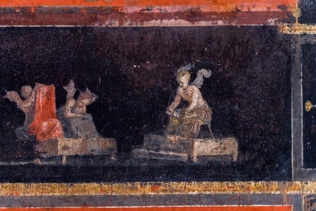 VI.15.1 Pompeii. March 2023. 
Part of painted panel from east wall at north end of cupids cleaning clothes in a fullery. Photo courtesy of Johannes Eber.

