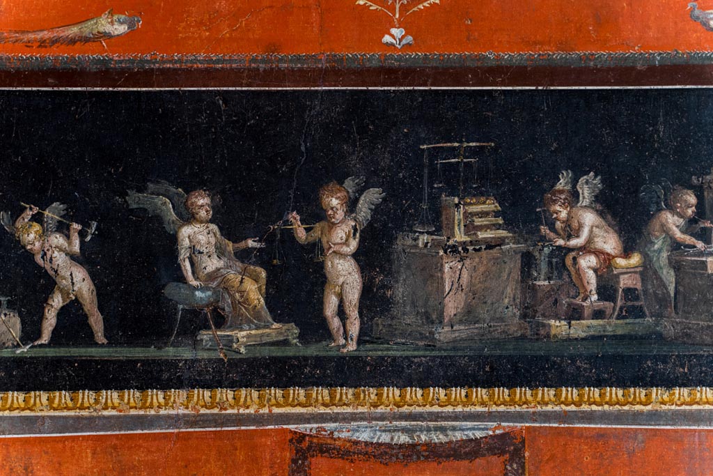 VI.15.1 Pompeii. March 2023. East wall with part of painted panel of cupid goldsmiths.Photo courtesy of Johannes Eber.