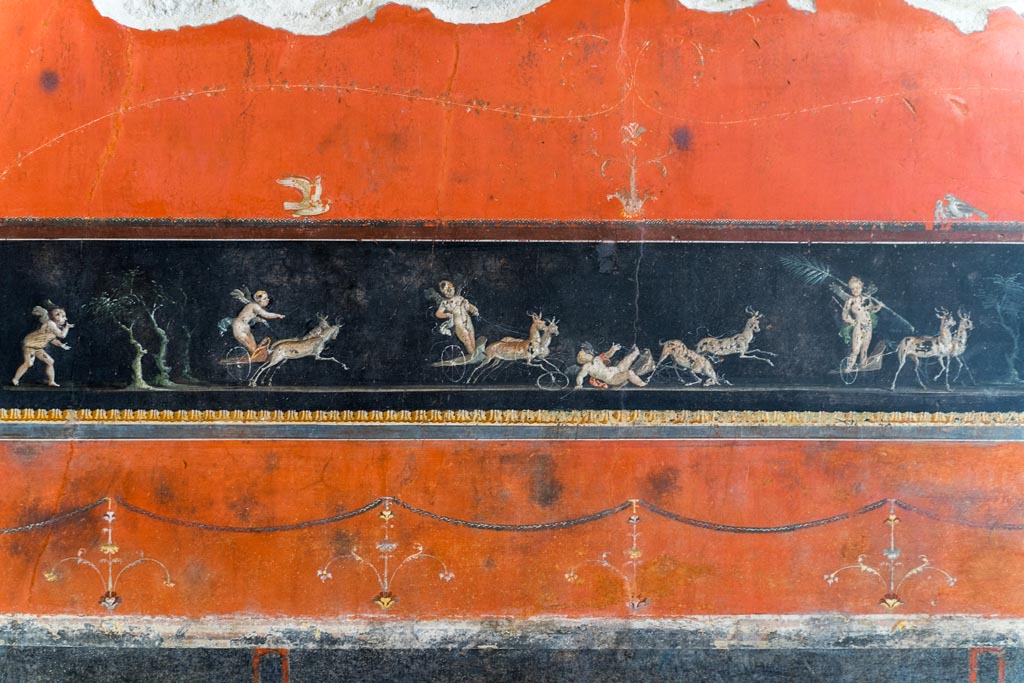VI.15.1 Pompeii. March 2023. 
Detail of part of central painted panel of cupids in a race between chariots pulled by deer. Photo courtesy of Johannes Eber.
