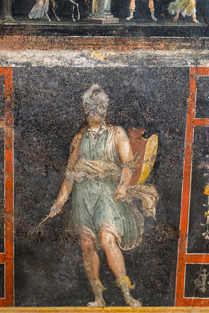 VI.15.1 Pompeii. March 2023. 
Lower east wall, painted panel of Amazon armed with a shield. beneath panel of a stag being sacrificed to Diana. 
Photo courtesy of Johannes Eber.
