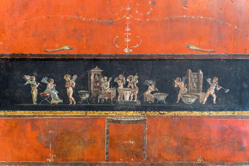 VI.15.1 Pompeii. March 2023. East wall at south end, painted panel of cupids making perfumed oil. Photo courtesy of Johannes Eber.

