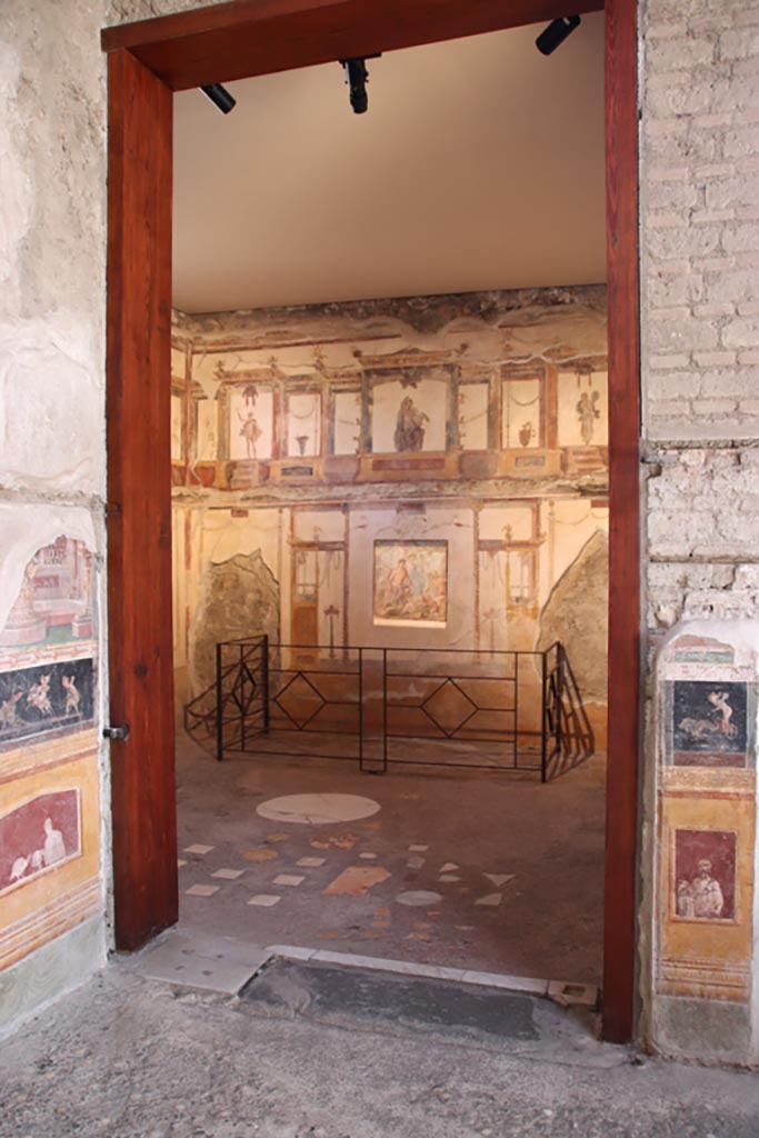 VI.15.1 Pompeii. October 2023. 
Doorway into oecus (e) in south-east corner of atrium. Photo courtesy of Klaus Heese.
