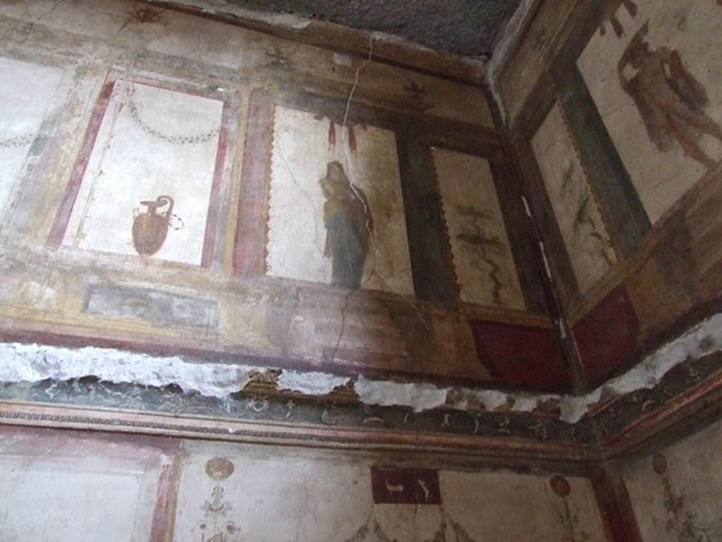 VI.15.1 Pompeii. December 2006. Detail of painting from upper north wall in north-east corner of oecus on south side of atrium.
