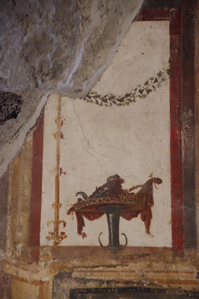 VI.15.1 Pompeii. October 2023. 
Detail of painted decoration from upper east wall. Photo courtesy of Klaus Heese.
