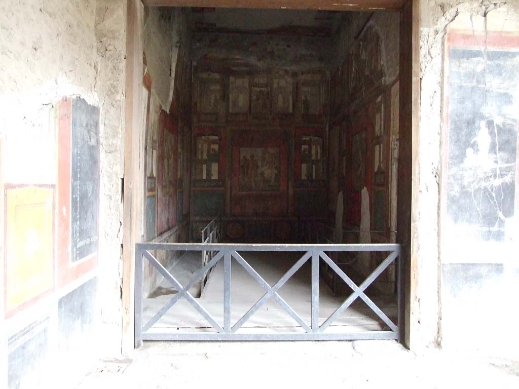 VI.15.1 Pompeii. December 2006. Looking east to doorway into exedra in north-east corner of peristyle.