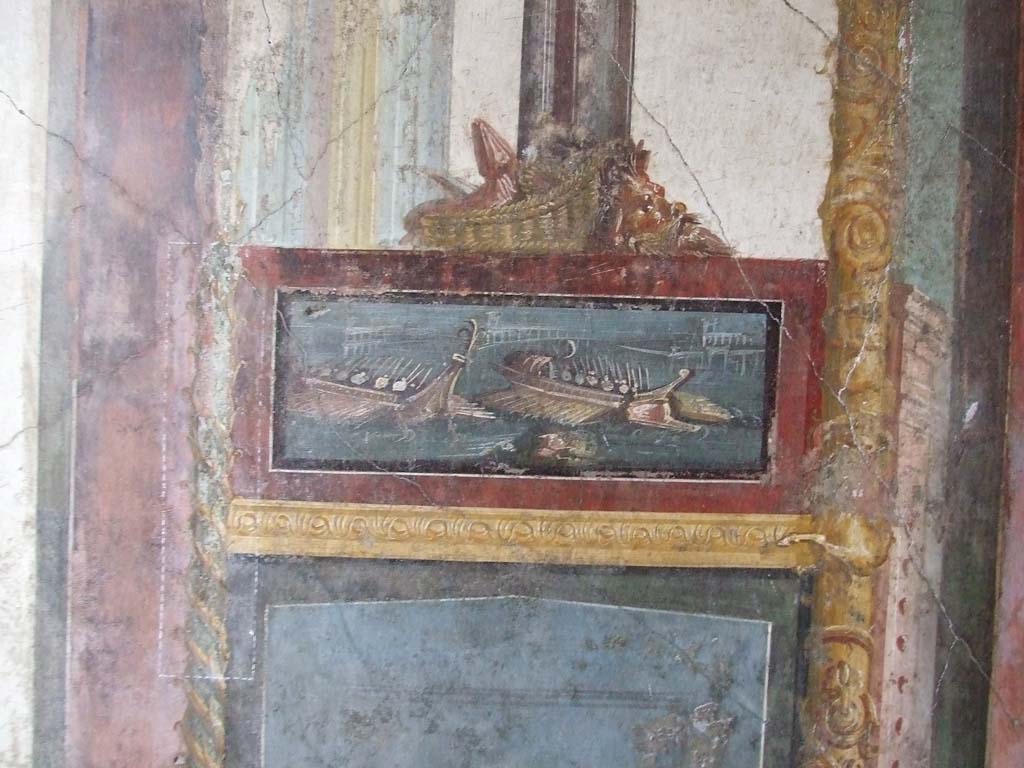 VI.15.1 Pompeii. December 2006. North wall of exedra with wall painting of naval scene, with basket and mask above.
